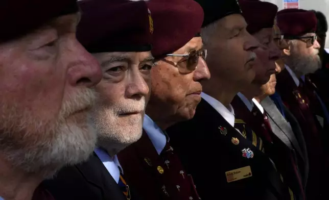 Canadian veterans stand commemorating the 60th anniversary of Canada's contribution to the UN Peacekeeping Force in Cyprus at Wolseley Barracks inside a UN-controlled buffer zone cleaving the capital Nicosia, Cyprus, Monday, Nov. 11, 2024. (AP Photo/Petros Karadjias)