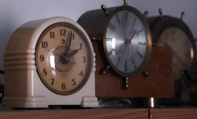 Vintage clocks are displayed at the Electric Time Company, Wednesday, Oct. 30, 2024, in Medfield, Mass. (AP Photo/Charles Krupa)