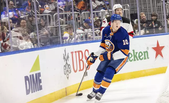 New York Islanders right wing Simon Holmstrom (10) during the second period in an NHL hockey game against the New Jersey Devils, Saturday, Nov. 9, 2024, in Elmont, N.Y. (AP Photo/Stefan Jeremiah)