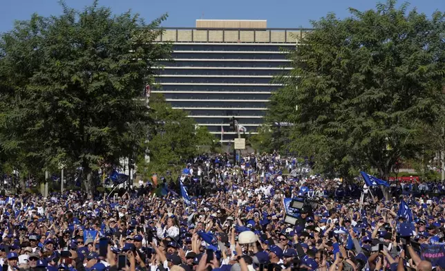 Fans cheer before the Los Angeles Dodgers baseball World Series championship parade Friday, Nov. 1, 2024, in Los Angeles. (AP Photo/Jae C. Hong)