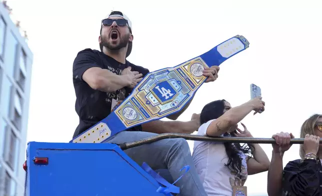 Los Angeles Dodgers' Alex Vesia yells in celebration during the Los Angeles Dodgers baseball World Series championship parade Friday, Nov. 1, 2024, in Los Angeles. (AP Photo/Jae C. Hong)