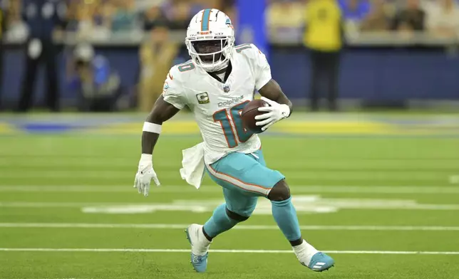 Miami Dolphins wide receiver Tyreek Hill runs the ball during the first half of an NFL football game against the Los Angeles Rams, Monday, Nov. 11, 2024, in Inglewood, Calif. (AP Photo/Jayne Kamin-Oncea)