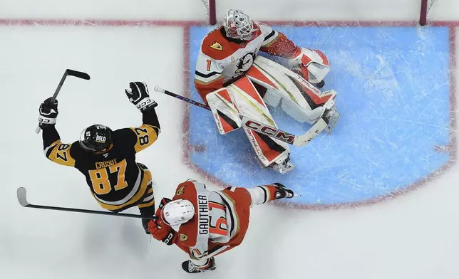 Pittsburgh Penguins' Sidney Crosby (87) celebrates after beating Anaheim Ducks goaltender Lukas Dostal for the game winner in overtime of an NHL hockey game Thursday Oct. 31, 2024 in Pittsburgh. (Chaz Palla/Pittsburgh Tribune-Review via AP)