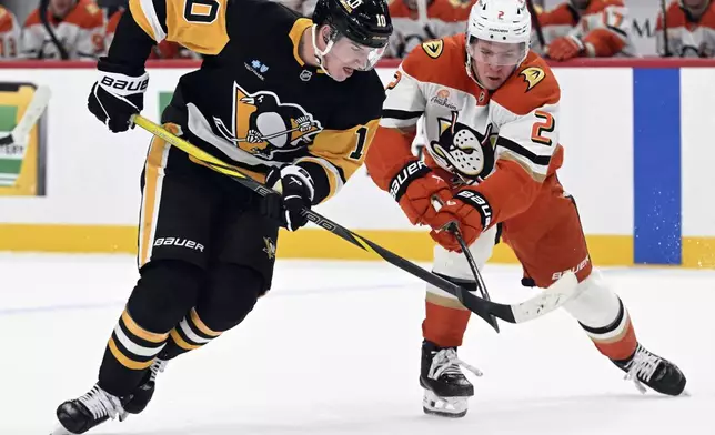 Anaheim Ducks' Jackson LaCombe (2) defends Pittsburgh Penguins' Drew O'Connor in the first period of an NHL hockey game Thursday Oct. 31, 2024 in Pittsburgh. (Chaz Palla/Pittsburgh Tribune-Review via AP)