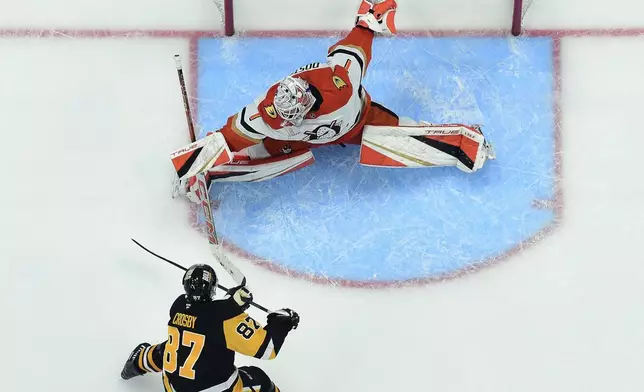 Pittsburgh Penguins' Sidney Crosby (87) beats Anaheim Ducks goaltender Lukas Dostal for the game winner in overtime of an NHL hockey game Thursday Oct. 31, 2024 in Pittsburgh. (Chaz Palla/Pittsburgh Tribune-Review via AP)