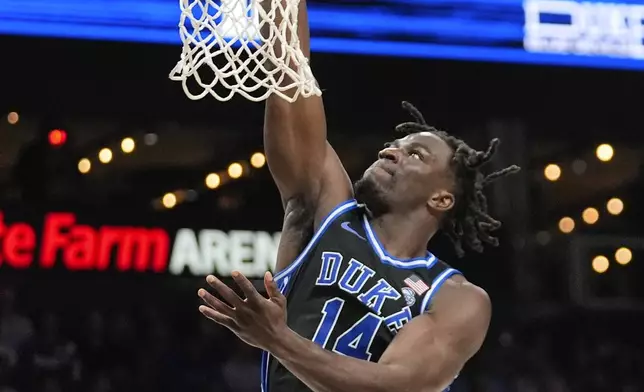 Duke Blue guard Sion James (14) scores during the second half of an NCAA college basketball game against Kentucky, Tuesday, Nov. 12, 2024, in Atlanta. (AP Photo/John Bazemore )