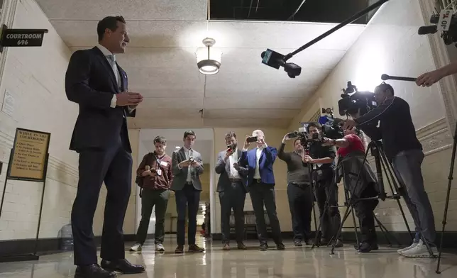 America PAC lawyer Chris Gober speaks with members of the media ahead of a hearing at a City Hall courtroom in Philadelphia, Monday, Nov. 4, 2024. (AP Photo/Matt Rourke)