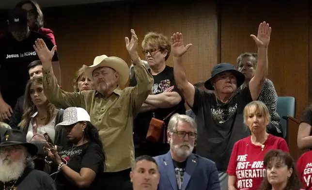 FILE - Predominantly anti-abortion supporters stand in the Arizona House gallery during the vote on the proposed repeal of Arizona's near-total ban on abortions prior to winning approval from the state House Wednesday, April 24, 2024, in Phoenix. (AP Photo/Ross D. Franklin, File)