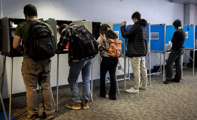 Voters cast their ballots in Denver on Election Day, Tuesday, Nov. 5, 2024. (AP Photo/Chet Strange)