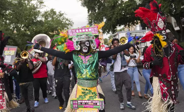 Students and members of the Zulu Tramps march to a campus polling place on Election Day at Southern University in Baton Rouge, La., Tuesday, Nov. 5, 2024. (AP Photo/Gerald Herbert)