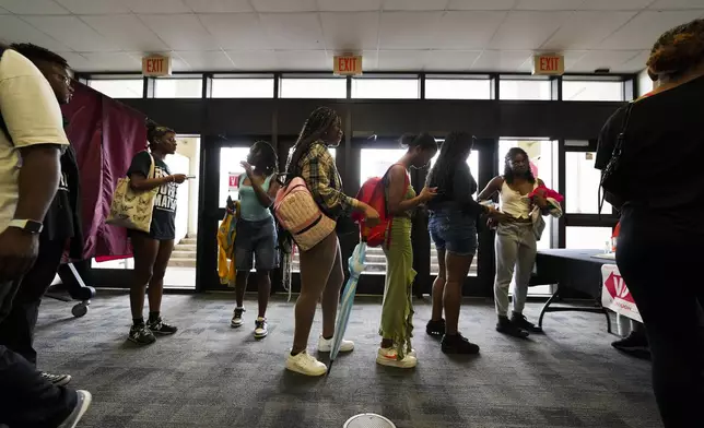 Students line up to vote at a campus polling place at Southern University in Baton Rouge, La., on Election Day, Tuesday, Nov. 5, 2024. (AP Photo/Gerald Herbert)