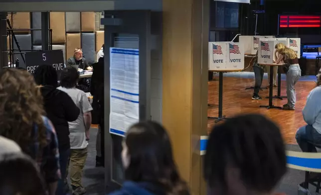 Voters wait in line to receive their ballots at Life Stream Church in Ottawa County, Mich. on Election Day, Tuesday, Nov. 5, 2024. (Joel Bissell /Kalamazoo Gazette via AP)