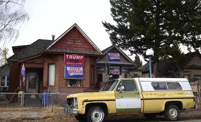 A home decorated to support Republican presidential nominee former President Donald Trump in Anaconda, Mont., on Election Day, Tuesday, Nov. 5, 2024. (AP Photo/Tommy Martino)