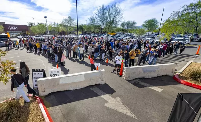 Voters wait in line to cast their ballots on election day Tuesday, Nov. 5, 2024, in Las Vegas. (L.E. Baskow/Las Vegas Review-Journal via AP)