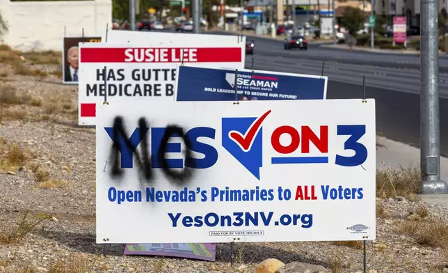 A vandalized election sign is seen along Buffalo Drive on Election Day in Las Vegas, Tuesday, Nov. 5, 2024. (L.E. Baskow/Las Vegas Review-Journal via AP)