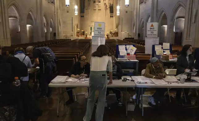 Voters cast their ballots at the Church of the Heavenly Rest in New York on Election Day, Tuesday, Nov. 5, 2024. (AP Photo/Yuki Iwamura)