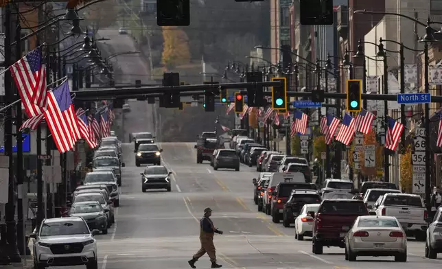 American flags line Main Street on Election Day, Tuesday, Nov. 5, 2024, in Butler, Pa. (AP Photo/Robert F. Bukaty)