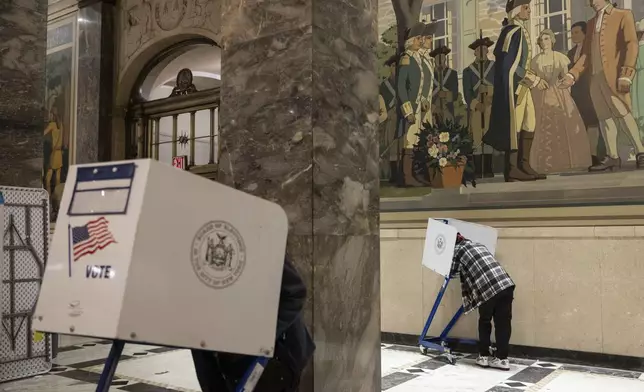 Voters cast their ballots at the Bronx County Supreme Court in New York on Election Day, Tuesday, Nov. 5, 2024. (AP Photo/Yuki Iwamura)