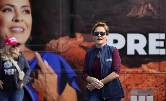 Republican candidate for U.S. Senate Kari Lake arrives to vote, Tuesday, Nov. 5, 2024, in Phoenix, Ariz. (AP Photo/Matt York)