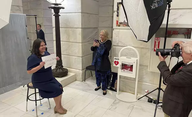 FILE - Caitlin Draper poses for an official photo at the Arkansas State Capitol in Little Rock, Ark., Nov. 6, 2023, after filing paperwork to run for the 3rd Congressional District. (AP Photo/Andrew DeMillo, File)