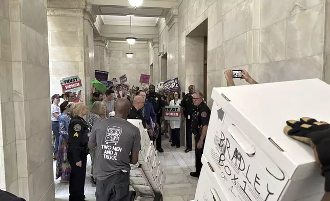 FILE - Boxes containing signatures supporting a proposed ballot measure to scale back Arkansas' abortion ban are delivered to a room in the state Capitol, July 5, 2024, in Little Rock, Ark. (AP Photo/Andrew DeMillo, File)