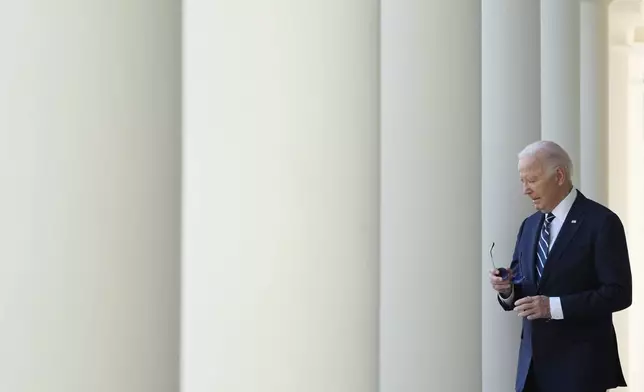 President Joe Biden walks to speak in the Rose Garden of the White House in Washington, Thursday, Nov. 7, 2024. (AP Photo/Mark Schiefelbein)