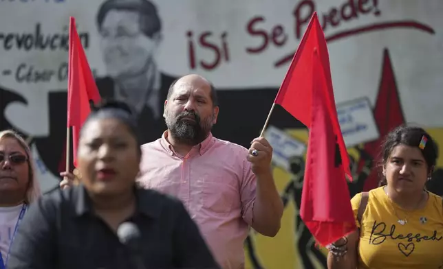 Members of La Unión del Pueblo Entero (LUPE), listen as Executive Director Tania Chavez makes statements about yesterday's election in San Juan, Texas, Wednesday, Nov. 6, 2024. (AP Photo/Eric Gay)