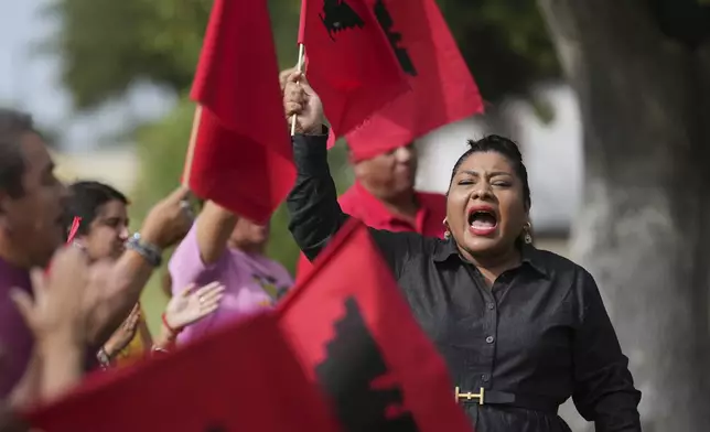 Tania Chavez, right, executive director of La Unión del Pueblo Entero (LUPE), leads members in a chant after making statements about yesterday's election, in San Juan, Texas, Wednesday, Nov. 6, 2024. (AP Photo/Eric Gay)