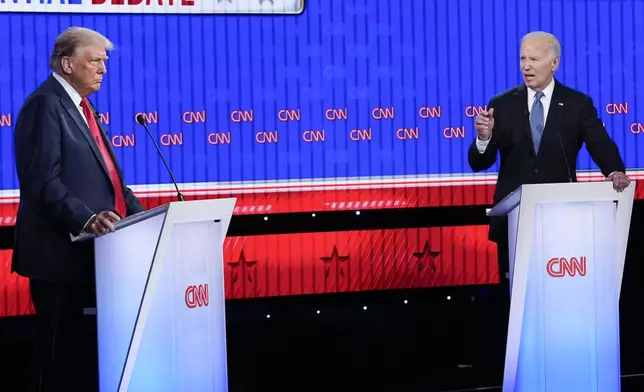 President Joe Biden, right, speaking during a presidential debate with Republican presidential candidate former President Donald Trump, left, Thursday, June 27, 2024, in Atlanta. (AP Photo/Gerald Herbert)