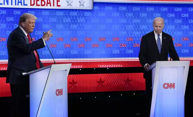 Republican presidential candidate former President Donald Trump, left, speaking during a presidential debate with President Joe Biden, right, Thursday, June 27, 2024, in Atlanta. (AP Photo/Gerald Herbert)