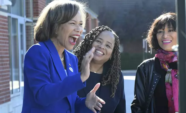 Rep. Lisa Blunt Rochester, D-Del, smiles after voting during early voting, Sunday, Nov. 3, 2024, in Wilmington, Del. (AP Photo/Gail Burton)