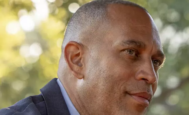 House Minority Leader Hakeem Jeffries, D-N.Y., center, during an interview with The Associated Press, Saturday, Oct. 12, 2024, in Irvine, Calif. (AP Photo/Julia Demaree Nikhinson)