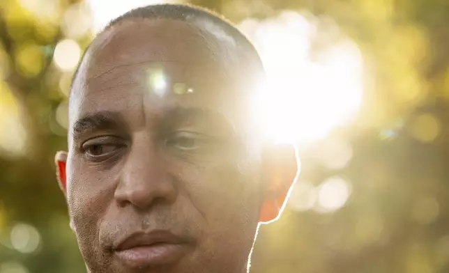 House Minority Leader Hakeem Jeffries, D-N.Y., center, during an interview with The Associated Press, Saturday, Oct. 12, 2024, in Irvine, Calif. (AP Photo/Julia Demaree Nikhinson)