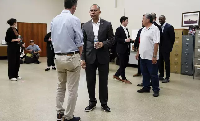 House Minority Leader Hakeem Jeffries, D-N.Y., speaks with George Whitesides before a canvass launch campaign event, Sunday, Oct. 13, 2024, in Palmdale, Calif. (AP Photo/Julia Demaree Nikhinson)