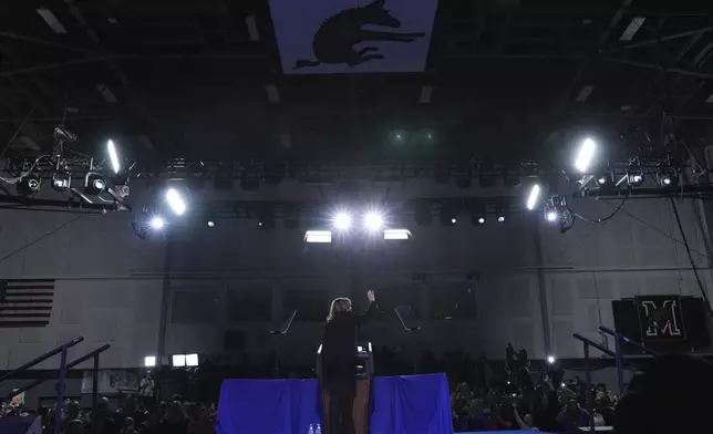 Small business owner Elizabeth Strong, right, introduces Democratic presidential nominee Vice President Kamala Harris, left, during a campaign rally in Memorial Hall at Muhlenberg College in Allentown, Pa., Monday, Nov. 4, 2024. (AP Photo/Jacquelyn Martin)