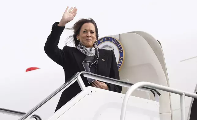 Democratic presidential nominee Vice President Kamala Harris waves as she boards Air Force Two at Detroit Metropolitan Wayne County Airport in Detroit, Monday Nov. 4, 2024, en route to Pennsylvania. (AP Photo/Jacquelyn Martin, Pool)