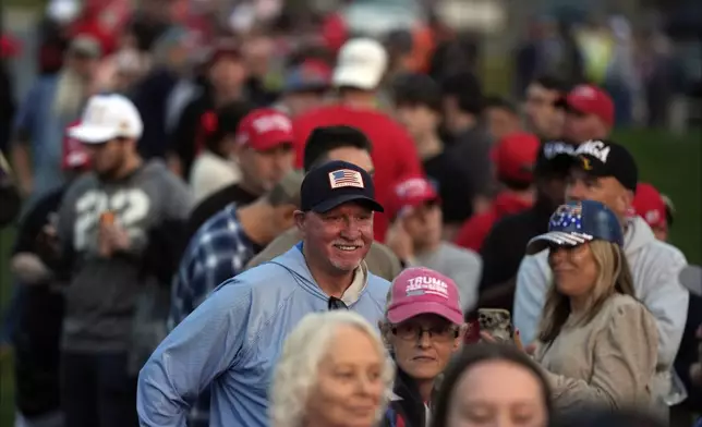 Supporters arrive before Republican presidential nominee former President Donald Trump speaks at a campaign rally in Gastonia, N.C., Saturday, Nov. 2, 2024. (AP Photo/Chris Carlson)