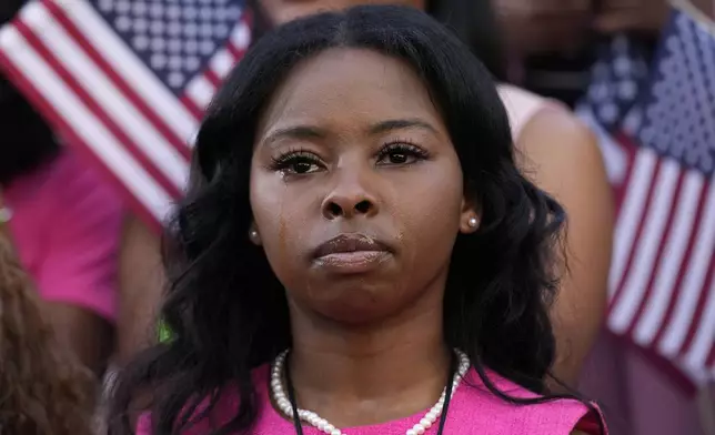 A supporter looks on as Vice President Kamala Harris delivers a concession speech for the 2024 presidential election, Wednesday, Nov. 6, 2024, on the campus of Howard University in Washington. (AP Photo/Susan Walsh)