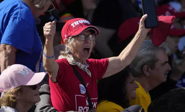 A supporter cheers as Republican presidential nominee former President Donald Trump speaks at a campaign rally in Gastonia, N.C., Saturday, Nov. 2, 2024. (AP Photo/Chris Carlson)