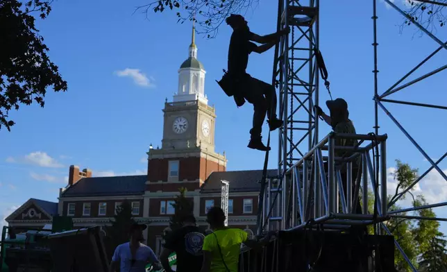 With Founders Library in the background, scaffolding is erected on the campus of Howard University in Washington as work begins in preparation for the election night venue for Democratic presidential nominee Vice President Kamala Harris, Friday, Nov. 1, 2024. (AP Photo/Pablo Martinez Monsivais)