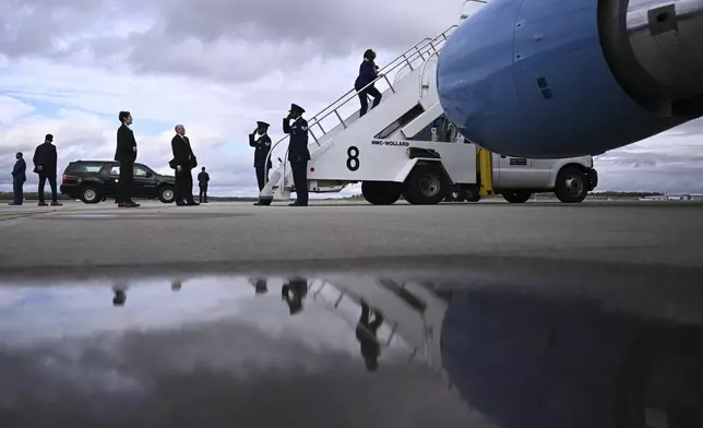 Democratic presidential nominee Vice President Kamala Harris boards Air Force Two before departing Dane County Regional Airport in Madison, Wis., Thursday, Oct. 31, 2024. (Brendan Smialowski/ Pool via AP)