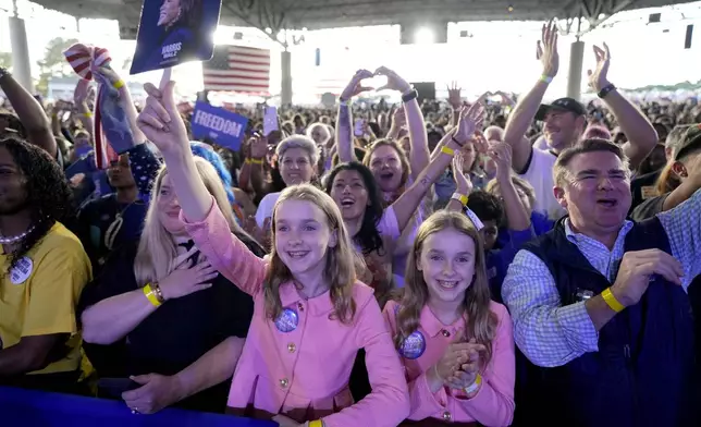 Supporters cheer as Democratic presidential nominee Vice President Kamala Harris speaks during a campaign rally, Saturday, Nov. 2, 2024, at the PNC Music Pavilion in Charlotte, N.C. (AP Photo/Jacquelyn Martin)