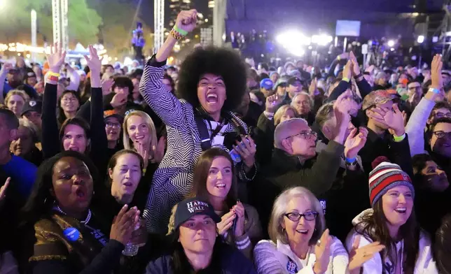 Attendees cheer as The Roots performs during a campaign rally for Democratic presidential nominee Vice President Kamala Harris outside the Philadelphia Museum of Art, Monday, Nov. 4, 2024, in Philadelphia. (AP Photo/Matt Rourke)