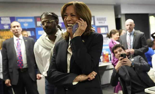 Democratic presidential nominee Vice President Kamala Harris phone banks with volunteers at the DNC headquarters on Election Day, Tuesday, Nov. 5, 2024, in Washington. (AP Photo/Jacquelyn Martin)