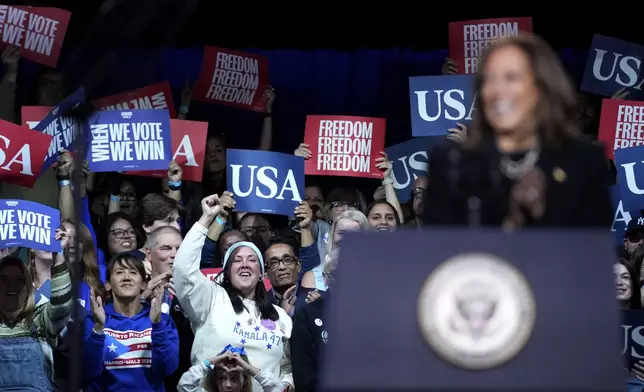 Supporters cheer as Democratic presidential nominee Vice President Kamala Harris speaks during a campaign rally in Memorial Hall at Muhlenberg College in Allentown, Pa., Monday, Nov. 4, 2024. (AP Photo/Susan Walsh)