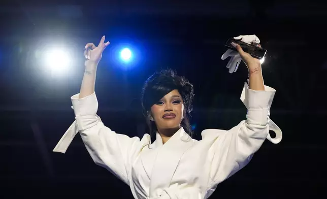 Cardi B gestures to the crowd during a campaign rally for Democratic presidential nominee Vice President Kamala Harris at the Wisconsin State Fair Expo in West Allis, Wis., Friday, Nov. 1, 2024. (AP Photo/Jacquelyn Martin)