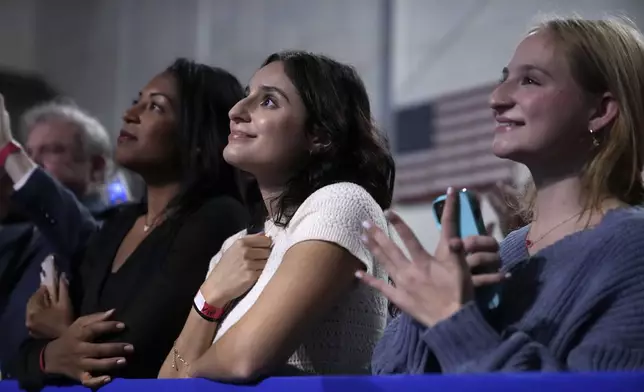 Supporters react as Democratic presidential nominee Vice President Kamala Harris speaks during a campaign rally in Memorial Hall at Muhlenberg College in Allentown, Pa., Monday, Nov. 4, 2024. (AP Photo/Jacquelyn Martin)