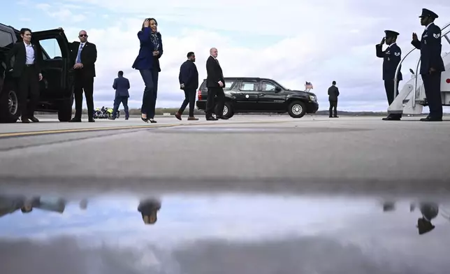 Democratic presidential nominee Vice President Kamala Harris walks to board Air Force Two before departing Dane County Regional Airport in Madison, Wis., Thursday, Oct. 31, 2024. (Brendan Smialowski/ Pool via AP)