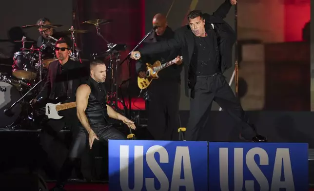 Ricky Martin performs at a campaign rally supporting Democratic presidential nominee Vice President Kamala Harris outside the Philadelphia Museum of Art, Monday, Nov. 4, 2024, in Philadelphia. (AP Photo/Matt Slocum)