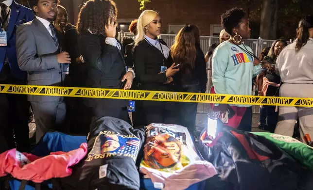 Howard University students and other attendees wait in an admission line ahead of an election night event for Democratic presidential nominee Vice President Kamala Harris at Howard University in Washington, Tuesday, Nov. 5, 2023. (AP Photo/Nathan Howard)